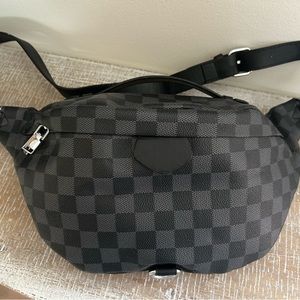 Boutique checkered sling bag. Black. New without tags.